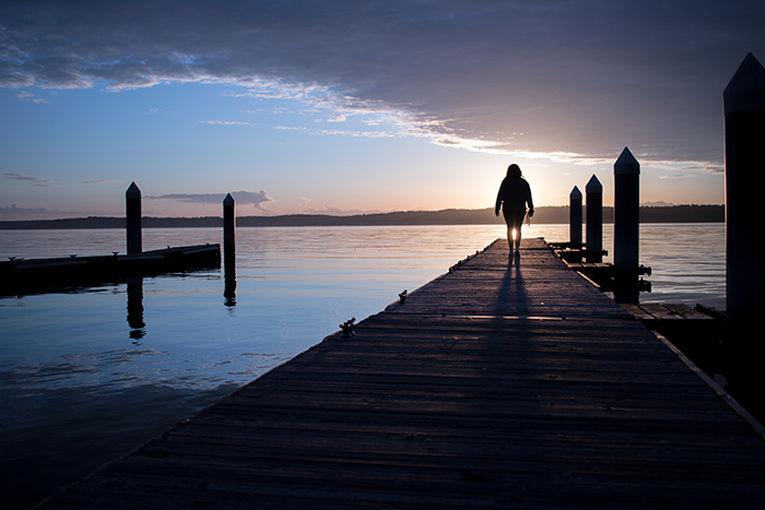 Photo of girl looking into the sunset